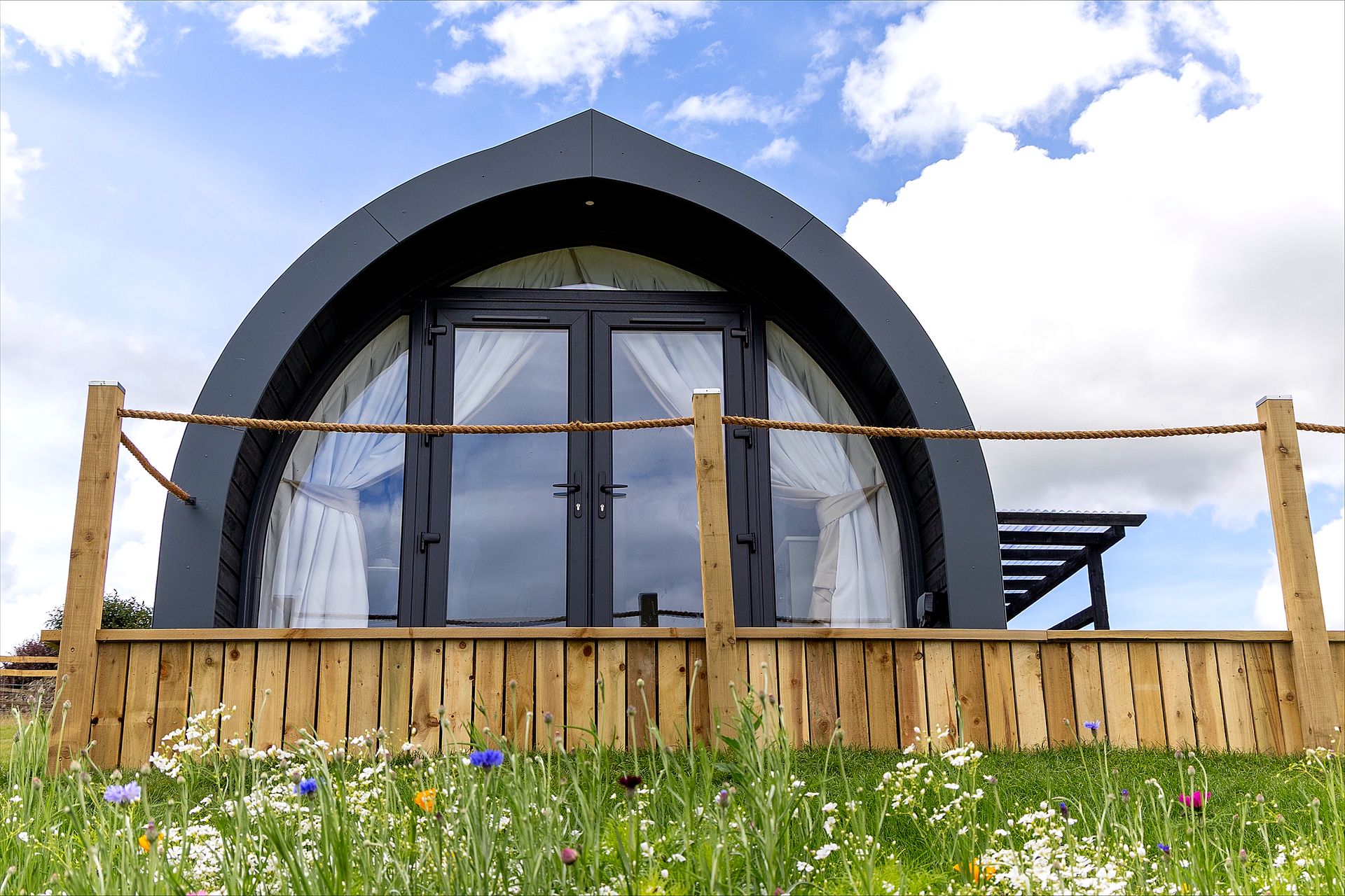 Skylark glamping pod exterior with wooden deck and Dales views